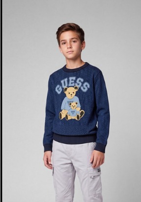 a boy wearing the sweater